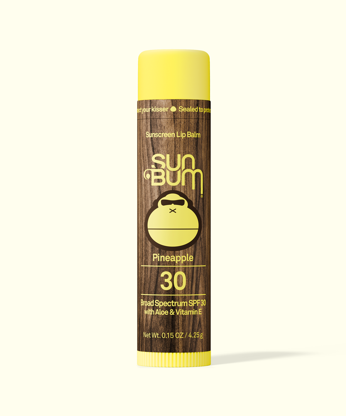 Sun Bum Pineapple sunscreen lip balm on a white background