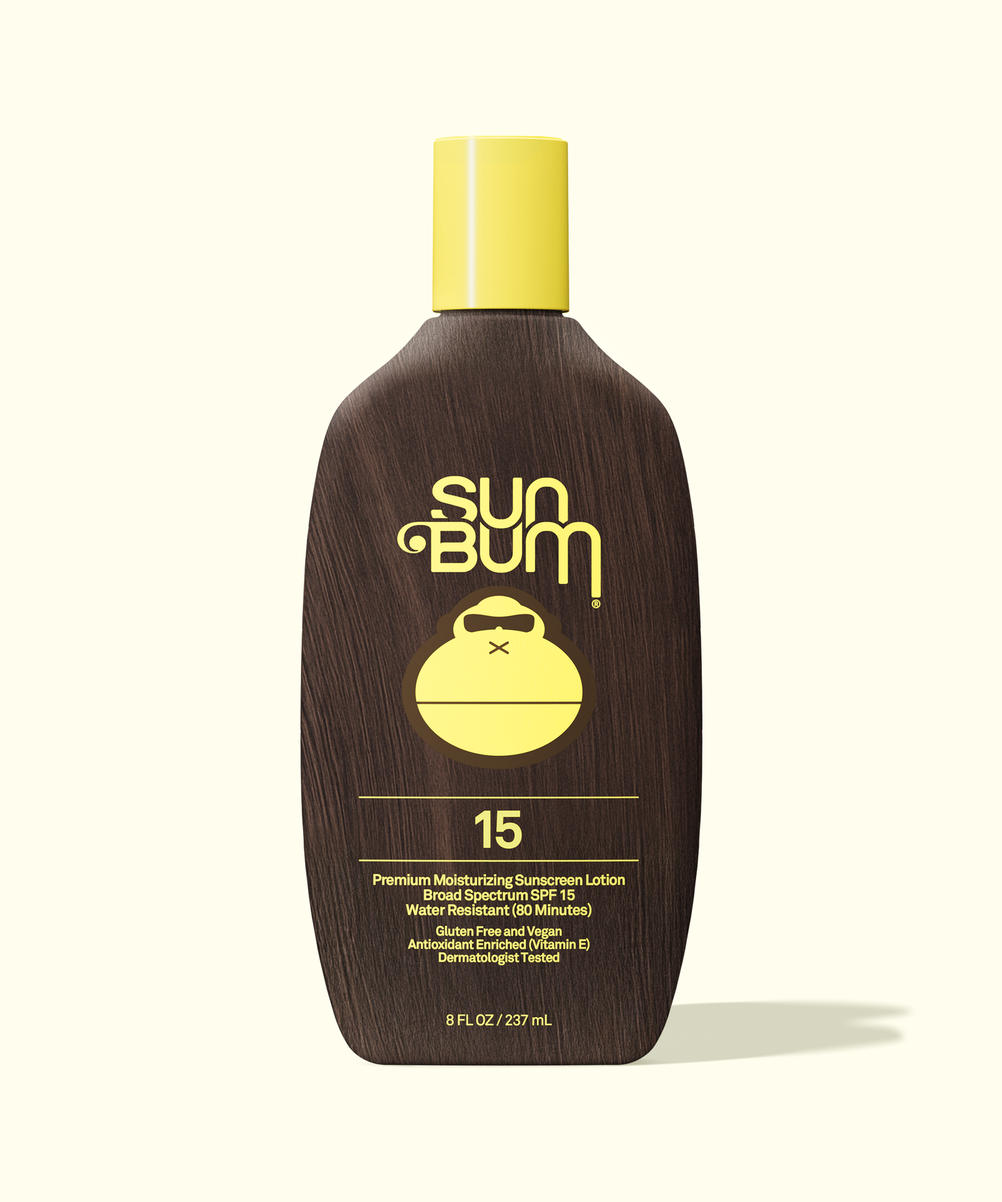 Sun Bum Original moisturizing sunscreen lotion SPF 15 with a yellow cap and wood-textured bottle design