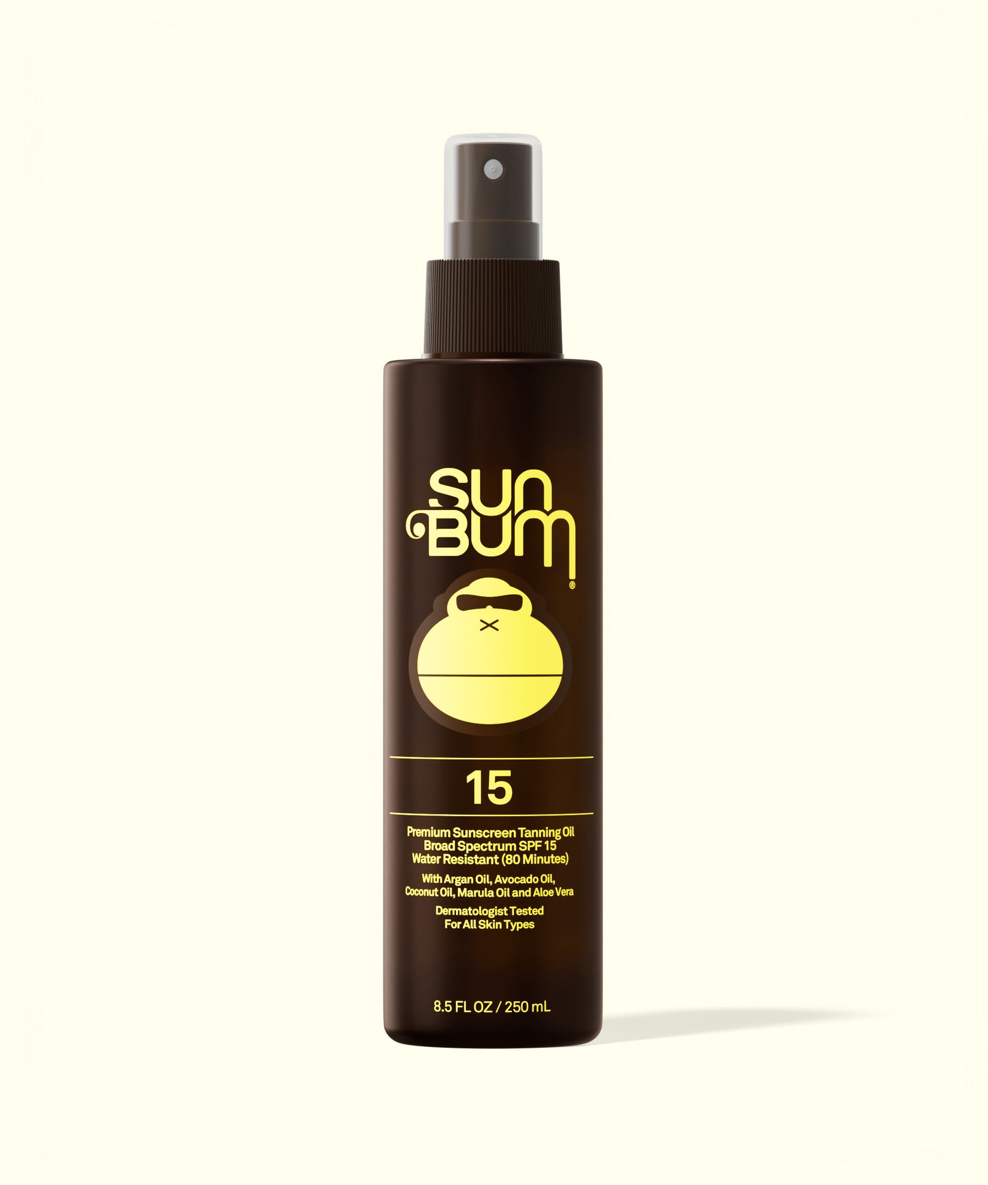 Sun Bum SPF 15 Sunscreen Tanning Oil in a brown spray bottle with yellow logo and text on white background